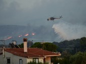 At least one killed as firefighters battle Greece blaze for second day
