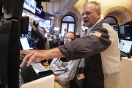 Wall Street rallies and the Dow soars 700 points on hopes for lower interest rates
