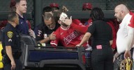 Angels' Taylor Ward carted off field after crashing into scoreboard
