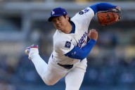 Shohei Ohtani gets first victory with Dodgers, striking out season
