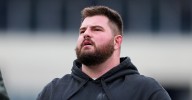 Landon Dickerson walking around after Eagles practice one day after knee procedure