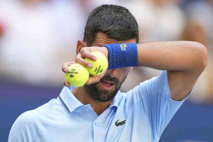 Djokovic prevails despite dull effort