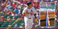 Yohel Pozo homers using bat painted with hospitalized children's handprints