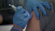 FDA approves new COVID-19 shots with limits on who gets them