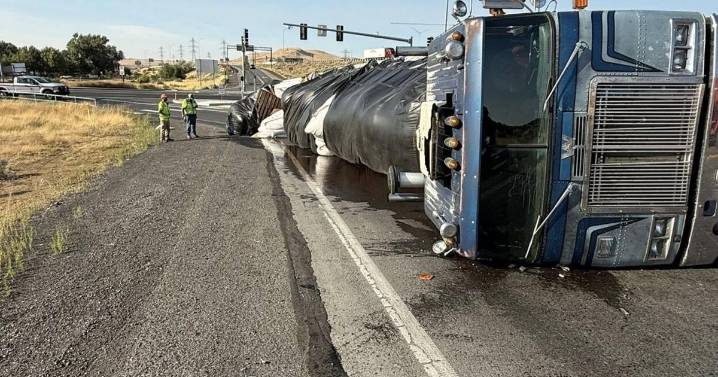 Semi-truck overturns on I
