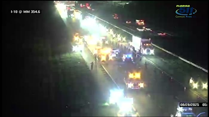 Woman dies in crash when car trying to merge onto I-10 hits semi, ricochets into DOT sign pole: FHP