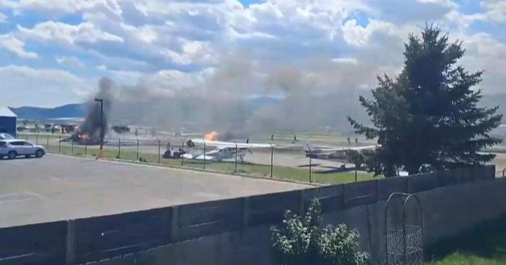 Plane crashes into parked aircraft while landing at Kalispell airport, sparking fire