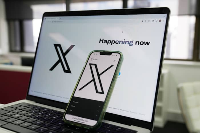 Musk says he plans to sue Apple for not featuring X or Grok among its top apps