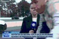 Watch shocking moment TV reporter is ROBBED by bike-riding phone snatcher live on camera