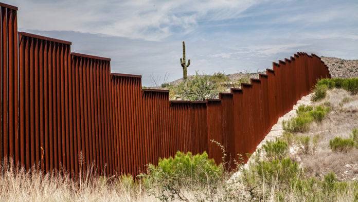 Texas Constructs Border Wall To Keep Out Unwanted Refugees From California