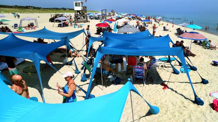Tents and cabanas spark backlash for crowding U.S. beaches this summer