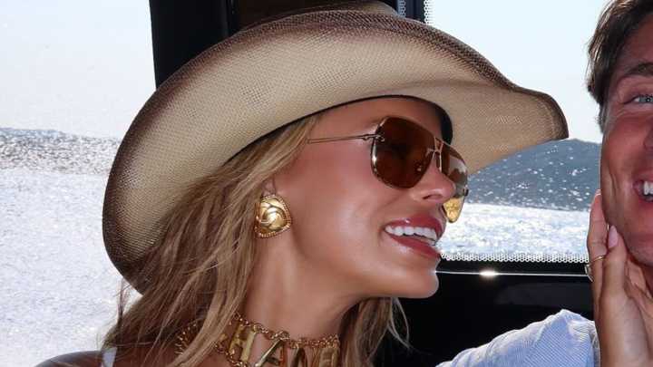 Brooks Nader suffers wardrobe malfunction as she goes braless in white dress on yacht in Italy