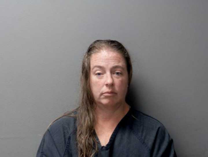Ferry Township woman arraigned for open murder in husband’s death