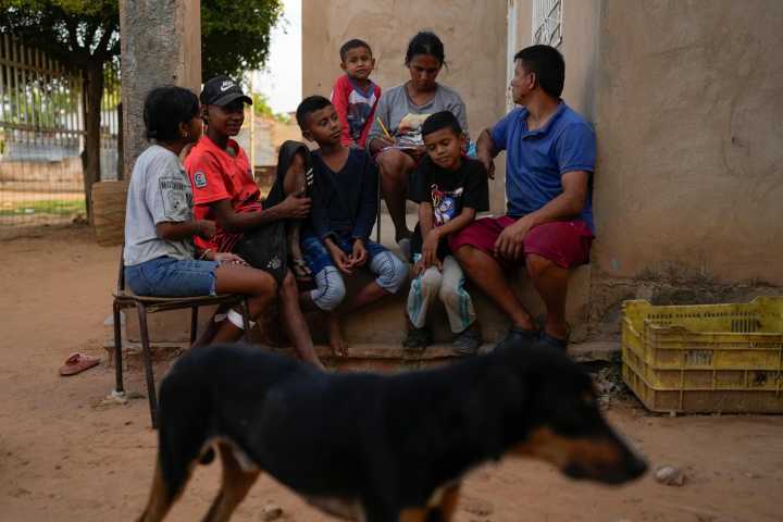 Migrants returning to Venezuela face debt and harsh living conditions