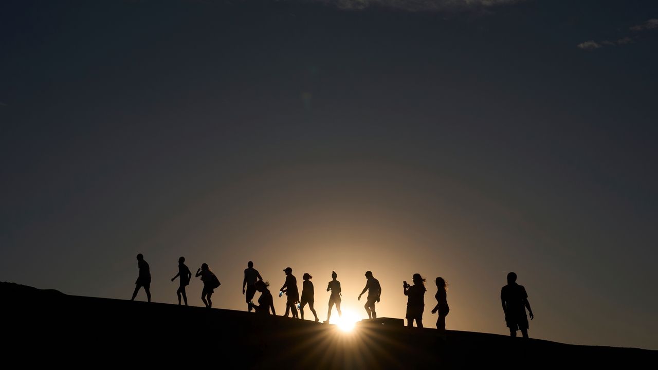 Searing heat draws visitors to California's Death Valley, where it's tough to communicate the risks