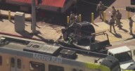 Driver collides with train, slams into sign outside King Taco in East Los Angeles