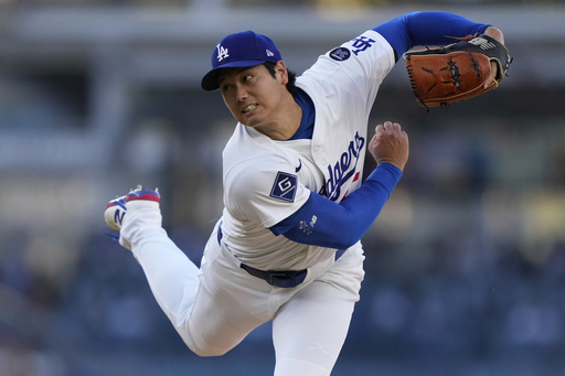 Shohei Ohtani gets first victory with Dodgers, striking out season