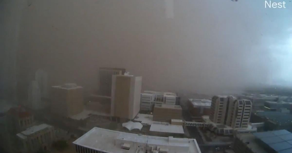 Haboob slams Phoenix with a towering wall of dust, causing damage, airport delays and power outages