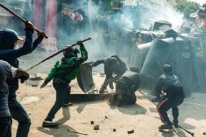 Indonesia police fire tear gas at protesters after driver’s death