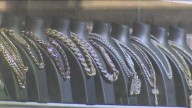 2 men accused of using fake money to steal $163K worth of jewelry from Boston store