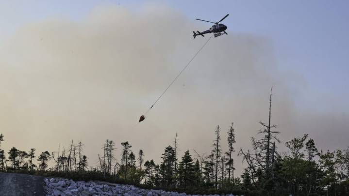 Pilot conscious, talking after helicopter crashes while fighting fires in Nova Scotia
