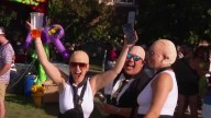 Pitbull fans dress up as 'Mr. Worldwide' at fairgrounds for Grandstand performance