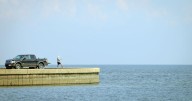 A small waterspout crossed over Lake Pontchartrain on the morning commute. See video.