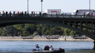 Mystery as bodies of FOUR men are pulled from Seine in Paris after train passenger spotted floating corpse