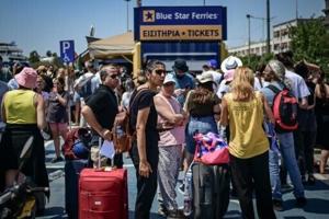Two tourists die, fires erupt in Greece amid gale