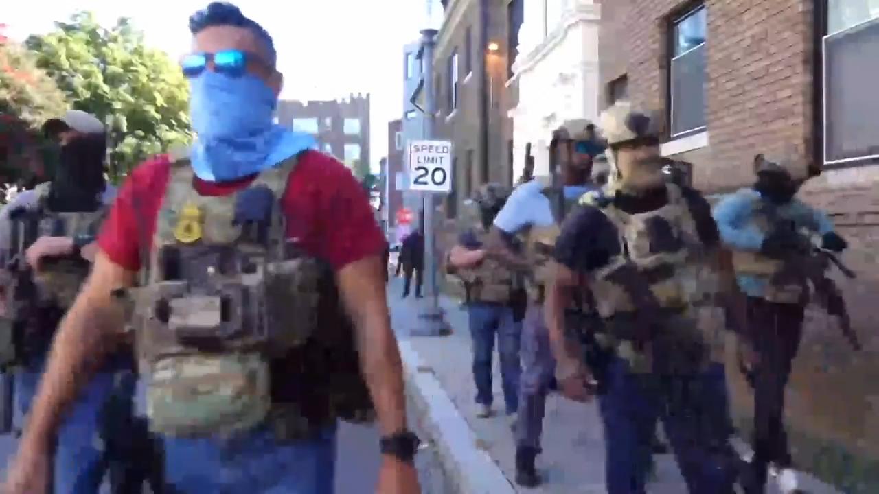 Heated standoff between DC residents and police captures unease over Trump's federal surge