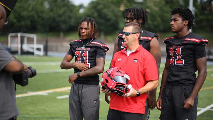 Delaware high school football players try to do an impression of their coach