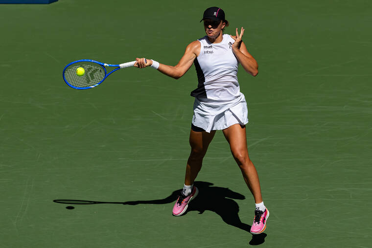 Iga Swiatek makes history by winning opener