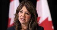 Smith defends charging Albertans for COVID