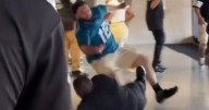 NFL fans throw haymakers as beer-bellied man's trousers fall down during stadium brawl