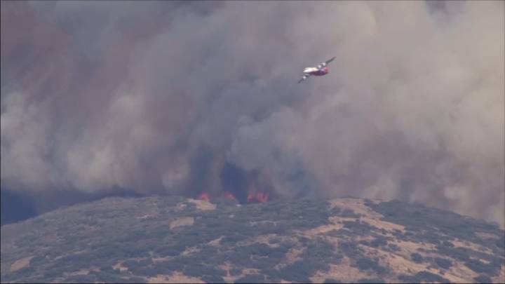 Brush fire burns in Action, threatens structures