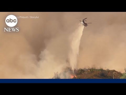 Firefighters battle raging fires and dangerous heat