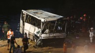 At least 18 dead and nine injured after bus plunges from bridge into a river after veering off the road in Algeria
