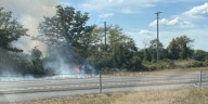 Firefighters battle wind-driven brush fire for hours