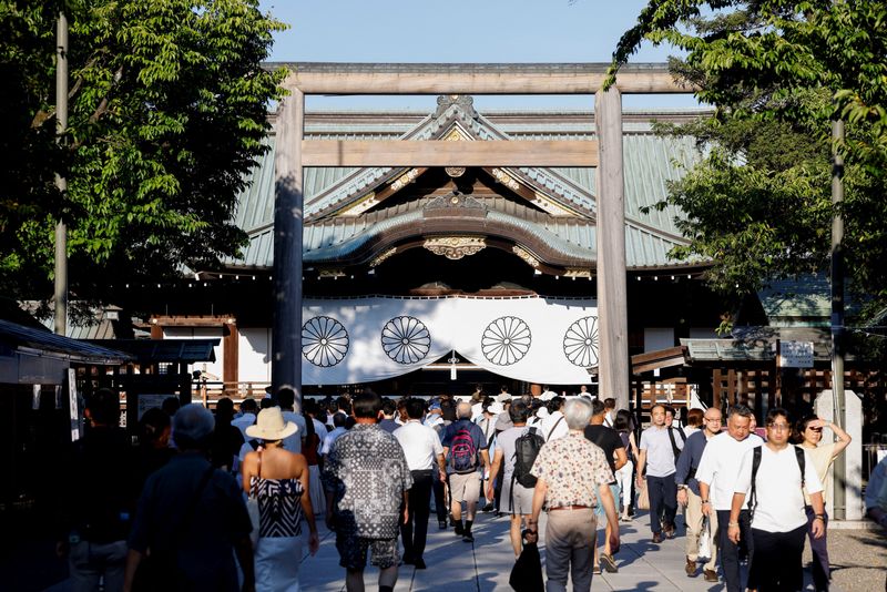 Japan minister joins crowds at controversial shrine to mark 80 years since world war defeat