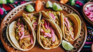 A Sweet Pantry Staple Is Your Ticket To Caramelized Pork Carnitas