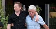 Phillip Schofield clings onto male companion as he leaves bar after failed TV comeback