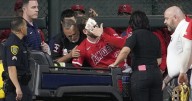 Angels' Taylor Ward carted off field after crashing into scoreboard