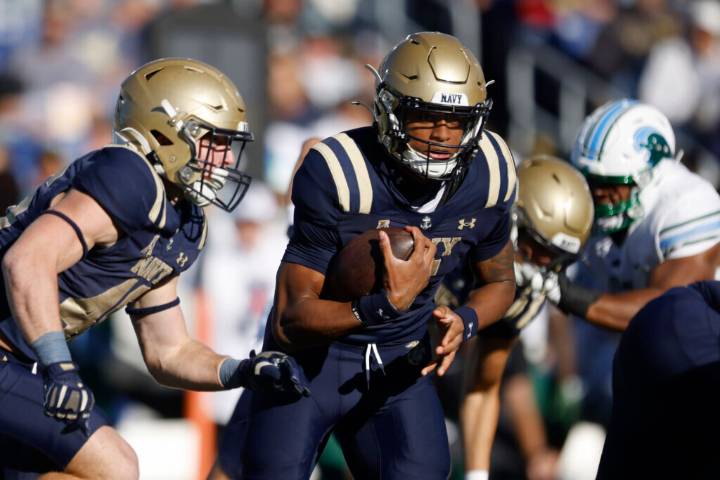 Backup QB Braxton Woodson runs for 180 yards, 2 long TDs and Navy rolls over VMI 52