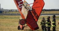 Single-engine biplane lands on nose after leaving runway in Colorado