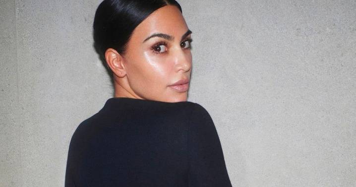 Kim Kardashian flashes famous bum in see-through bikini for cheeky photos