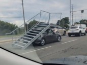 Weird video shows driver, 22, with staircase on her car’s roof