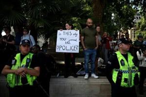 UK arrests 200 backing banned pro