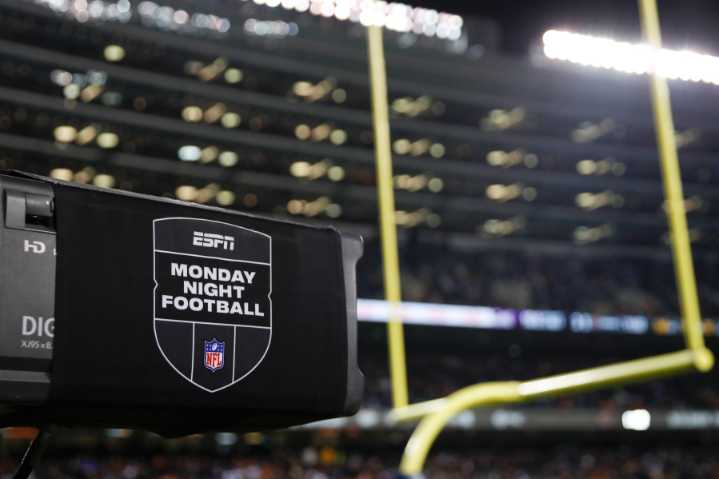 ESPN is acquiring NFL Network, rights for RedZone in a deal giving the NFL a stake in the network