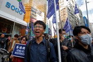 China angered as Hong Kong activists granted asylum in UK, Australia