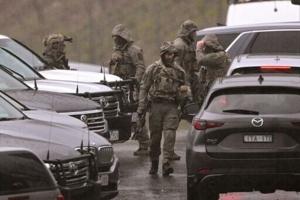 Australian police urge gunman to surrender after officers killed